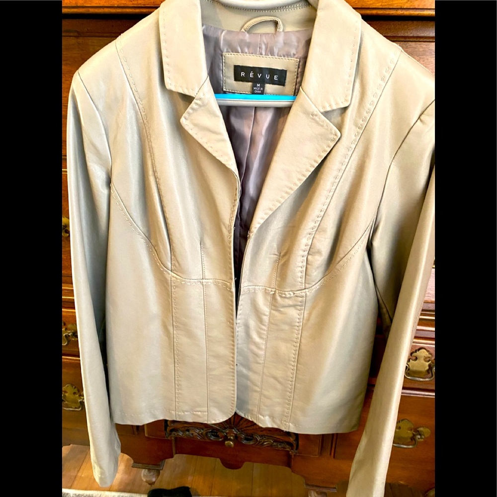 Woman’s jacket. Tan color.  Hook and loop closure